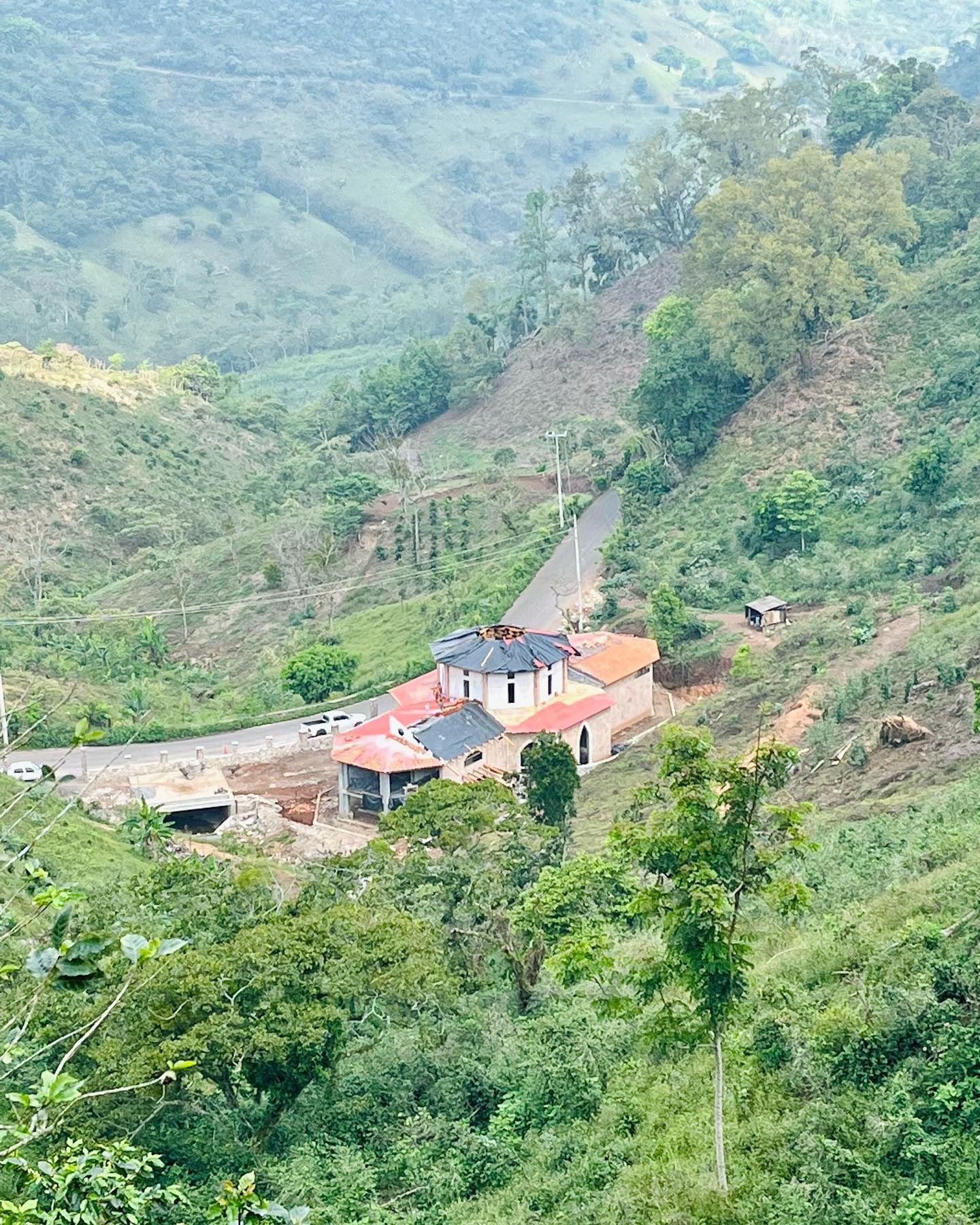 Aerial view of the Gaia Reborn buildings on the hillside
